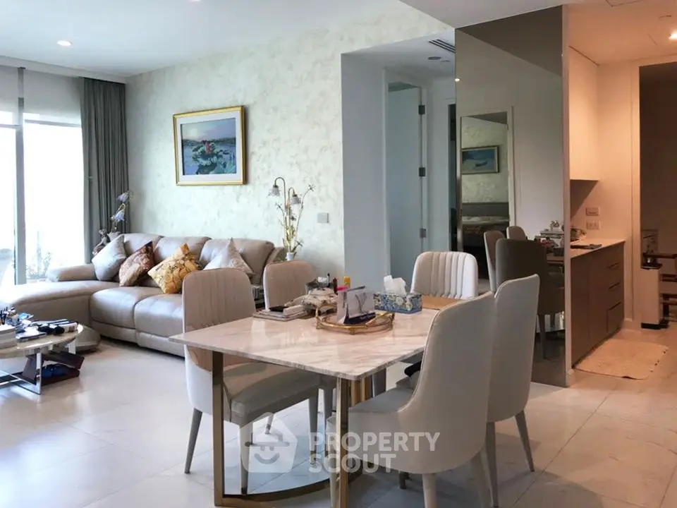 Spacious modern living room with elegant dining area and cozy seating, perfect for family gatherings.