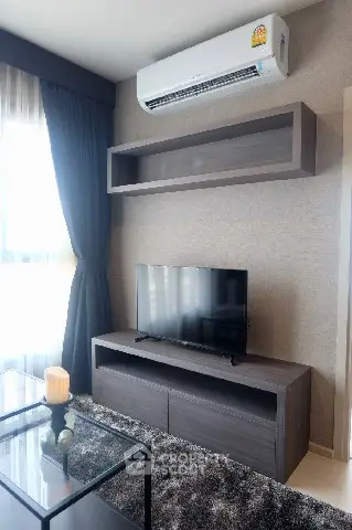 Modern living room with sleek TV stand and air conditioning unit