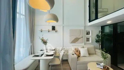 Modern living room with elegant dining area and stylish decor in a bright, open-concept space.