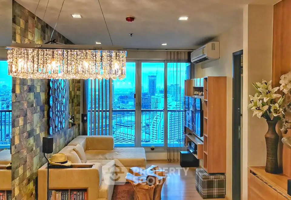 Luxurious living room with stunning city view, elegant chandelier, and modern decor in high-rise apartment.