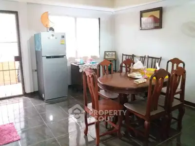 Cozy dining area with wooden furniture and natural light