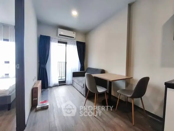 Modern living room with balcony access in a stylish apartment