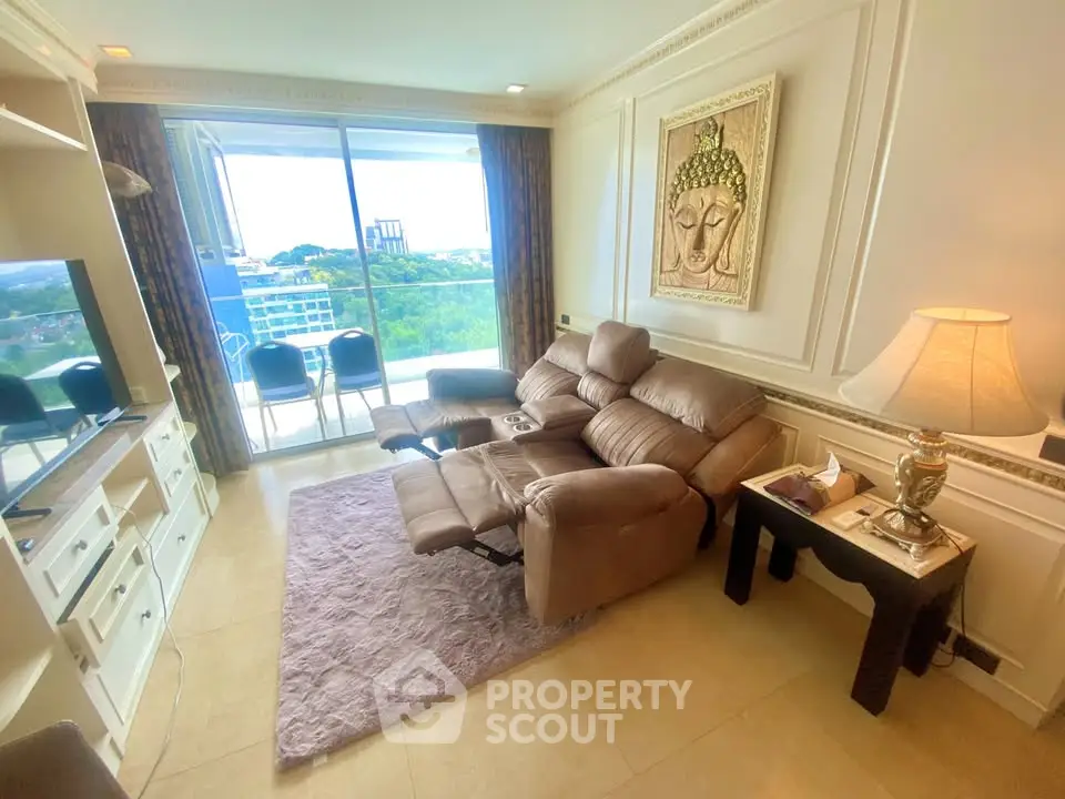Luxurious living room with reclining sofa and stunning balcony view