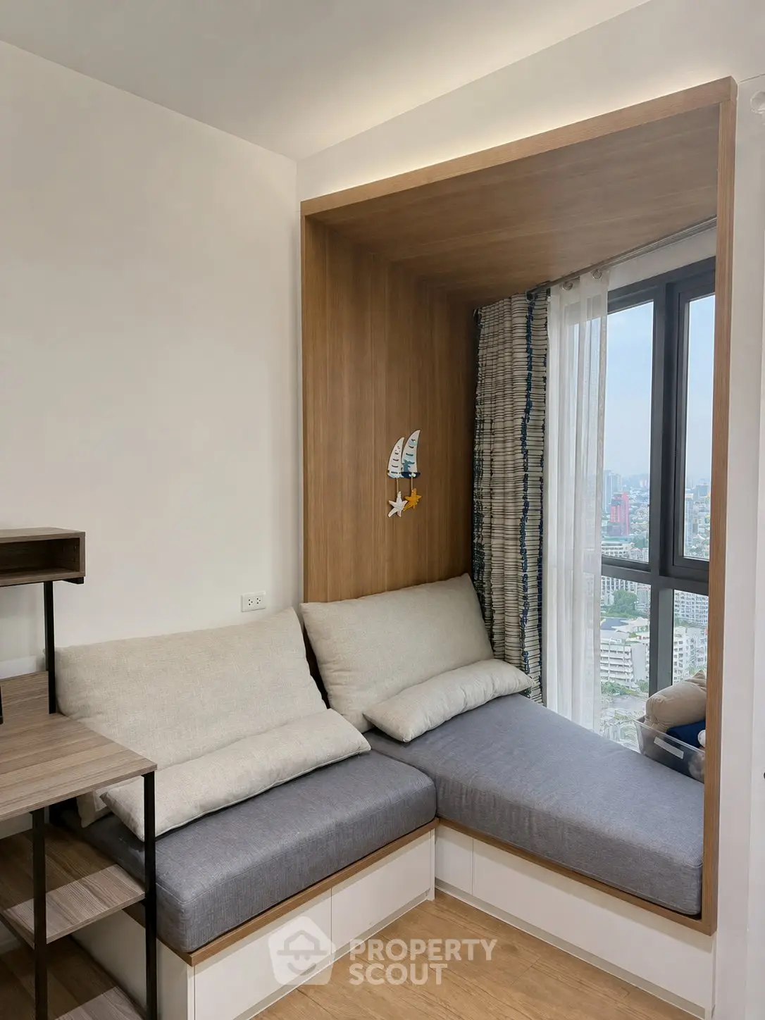 Cozy corner seating with city view in modern apartment