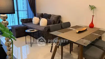 Modern living room with stylish furniture and elegant decor in a cozy apartment setting.