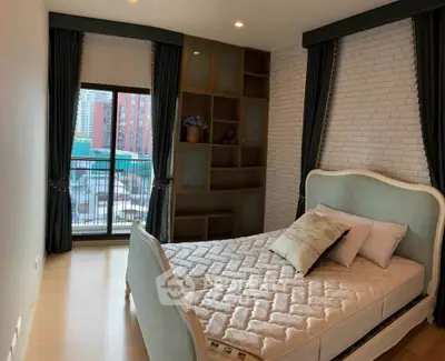 Chic bedroom with elegant bed, stylish shelving, and city view balcony in modern apartment.