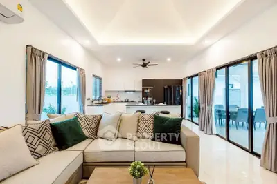Spacious modern living room with open kitchen and elegant decor