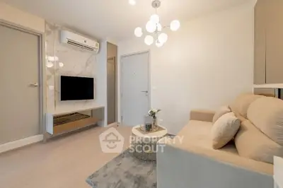 Modern living room with stylish decor and cozy seating in a contemporary apartment.