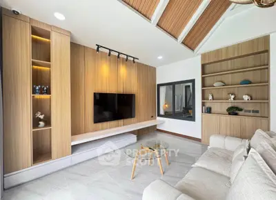 Modern living room with stylish wooden paneling and sleek furniture