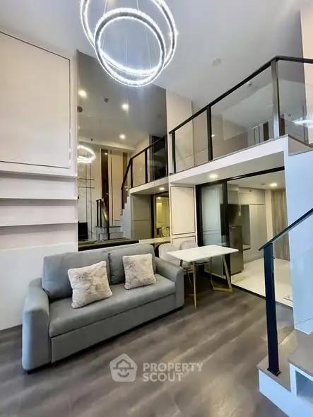 Modern duplex living room with stylish lighting and open layout