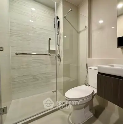Modern bathroom with glass shower and sleek fixtures