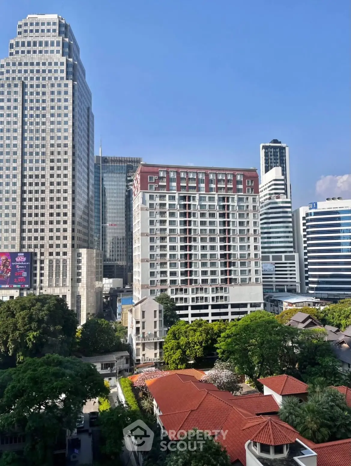 Stunning cityscape view with modern skyscrapers and lush greenery, perfect for urban living enthusiasts.