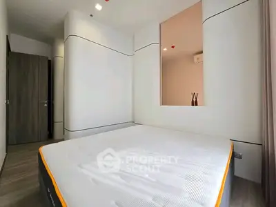 Modern minimalist bedroom with unique wall design and large window