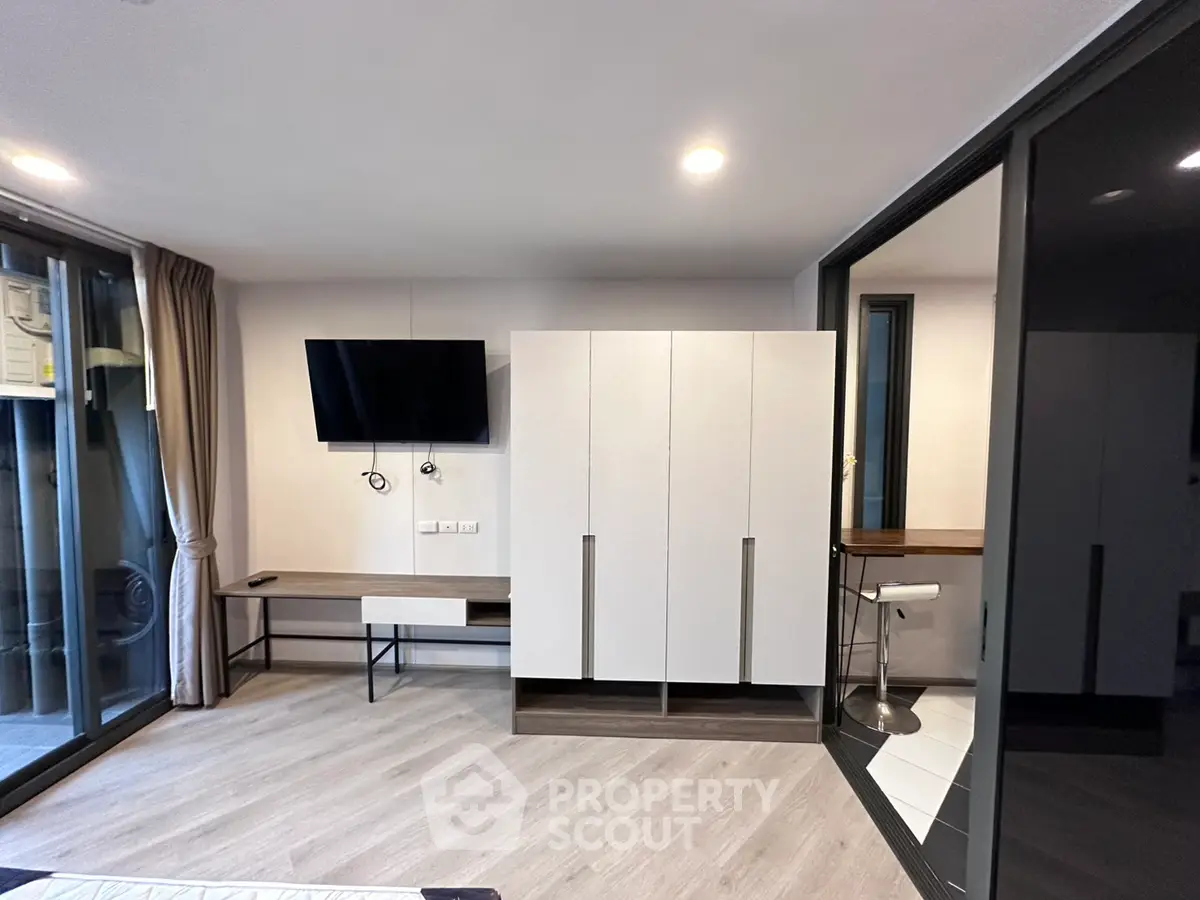 Modern living room with sleek furniture and large windows for natural light