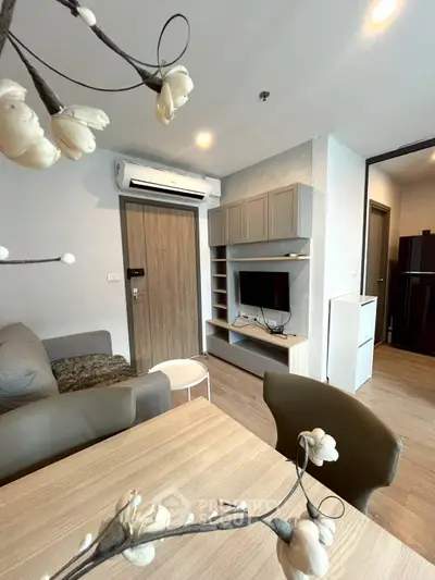 Modern living room with stylish furniture and air conditioning in a cozy apartment.