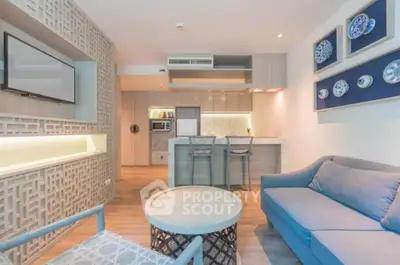 Modern living room with open kitchen and stylish decor