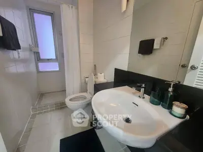 Modern bathroom with sleek fixtures and walk-in shower