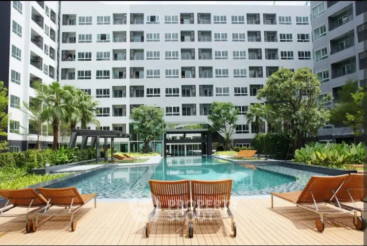 Luxurious apartment complex with stunning pool and lush greenery