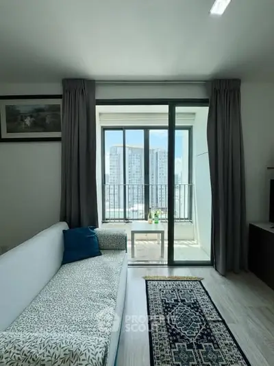 Modern living room with balcony view in high-rise apartment