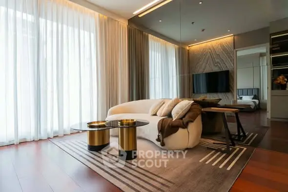 Luxurious modern living room with elegant decor and large windows