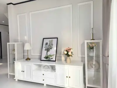 Elegant living room with white furniture and decorative plants