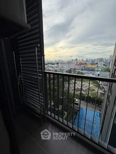 Stunning urban view from a high-rise balcony overlooking the city skyline, perfect for city living enthusiasts.