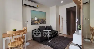 Modern living room with stylish decor and cozy seating area in a contemporary apartment.