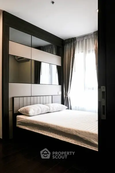 Modern bedroom with sleek design and ample natural light