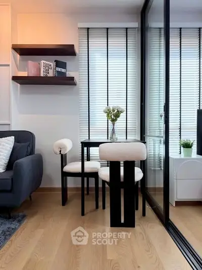 Modern living room with stylish furniture and large windows