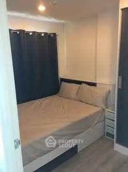 Cozy bedroom with modern decor and soft lighting, perfect for relaxation.