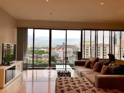 Spacious living room with city view and modern decor