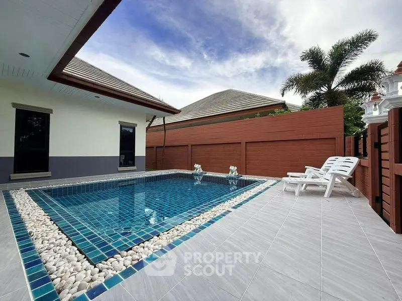 Luxurious private pool area with elegant tile design and serene ambiance, perfect for relaxation and entertainment.