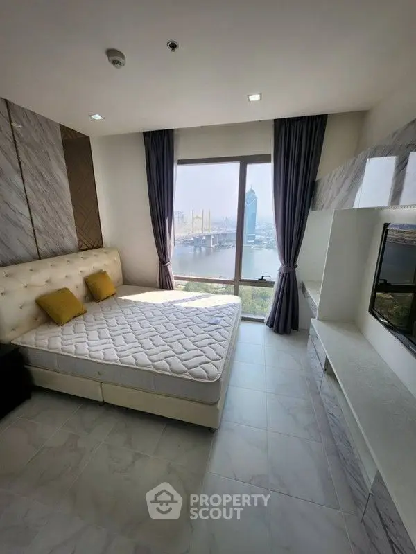 Luxurious bedroom with stunning city view and elegant decor