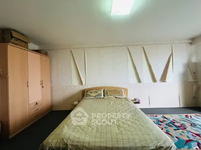 Cozy bedroom with unique wall design and colorful rug