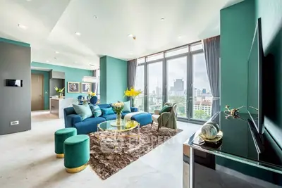 Luxurious modern living room with city view, elegant decor, and open layout in high-rise apartment.