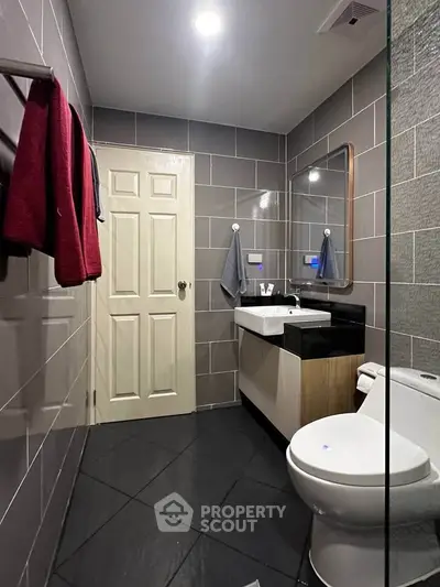 Modern bathroom with sleek tiles and contemporary fixtures