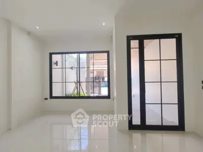 Spacious modern living room with large windows and sleek design