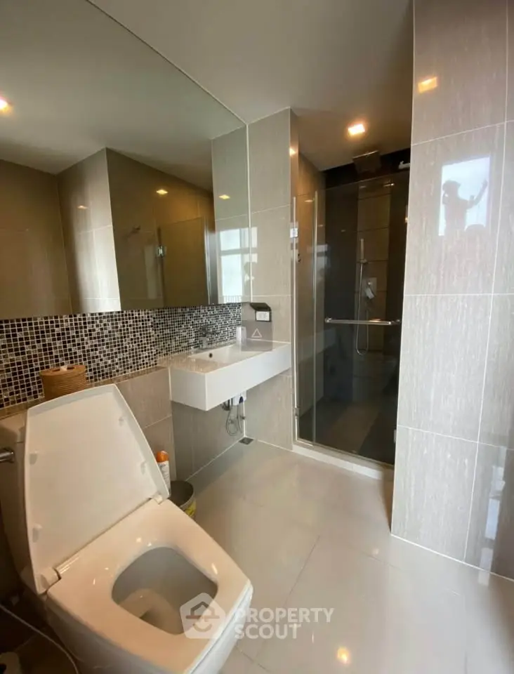 Modern bathroom with sleek design and glass shower enclosure