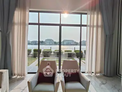 Luxurious living room with stunning waterfront view and elegant decor