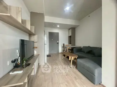 Modern living room with sleek furniture and open layout, perfect for urban living.