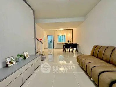 Spacious modern living room with sleek design and elegant dining area