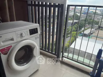 Balcony with washing machine and city view, perfect for urban living convenience.