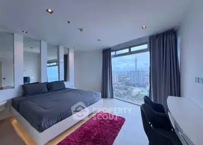 Luxurious bedroom with stunning city view and modern decor