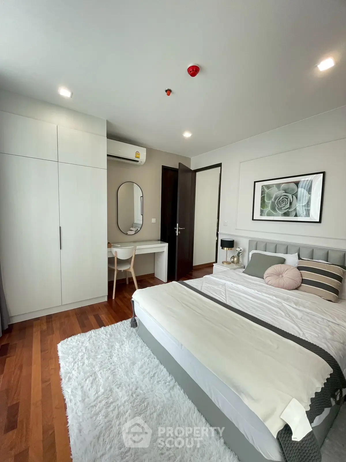 Modern bedroom with elegant decor and wooden flooring