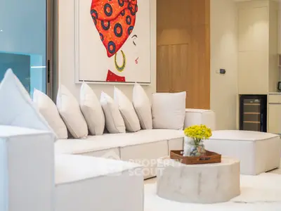 Luxurious modern living room with stylish decor and plush white sofa, perfect for relaxation and entertaining.