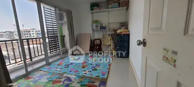 Cozy children's playroom with balcony access in urban apartment