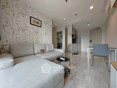 Modern living room with stylish decor and open kitchen layout
