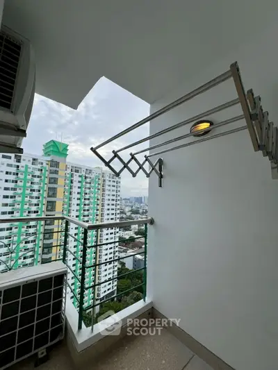 High-rise balcony with city view and modern railing