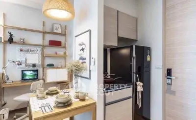 Modern studio apartment with compact kitchen and cozy dining area, perfect for urban living.
