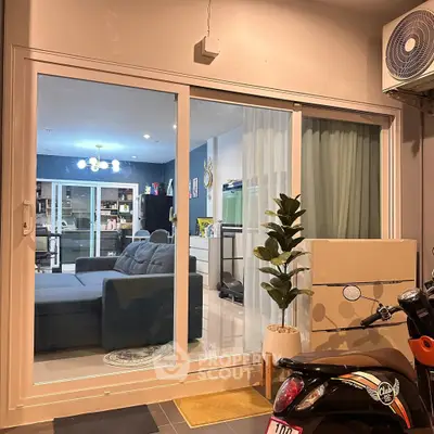 Modern living room with sliding glass doors and stylish decor